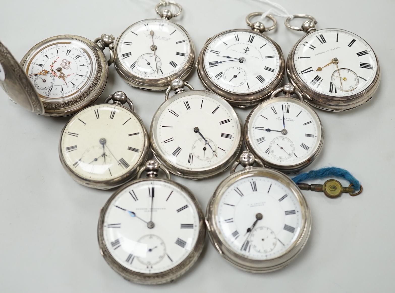 Nine assorted silver or white metal pocket watches including Joseph Stromier and John Forrest.